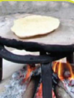 Το ψήσιμο των λαγγόπιττων. &lt;br/&gt; Άδεια δημοσίευσης: Υπουργείο Γεωργίας.