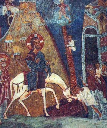 Το δέντρο φοίνικας σε τοιχογραφία (μέσα 11ου αι.) της Εισόδου του Ιησού στα Ιεροσόλημα από τον ναό του Αγίου Νικολάου Στέγης στην Κακοπετριά.